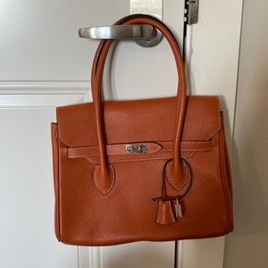 French handmade leather satchel. Found in a market in Normandy, France.